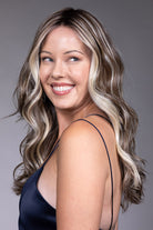Poppy by Belle Tress long wavy synthetic wig with a lace front, mono part, and bright blonde money piece highlights.