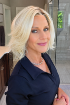 Woman wearing platinum blonde bob wig (Yvette by PUSH Hair in Bombshell Blonde). 