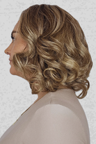 Woman wearing Lily by PUSH Hair in color Sunlit Almond R against a neutral background, side profile