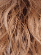 Peaches & Cream | A warm peach blonde base with creamy undertones and bright cream-white face-framing highlights. A rich chocolate root adds contrast, creating a vibrant, playful, yet sophisticated look.