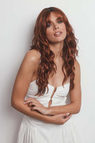 Phillipa synthetic lace front wig in auburn with long, tousled waves and face-framing fringe.