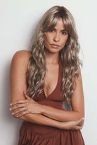 Phillipa synthetic lace front wig with long, wavy ash-blonde layers and face-framing fringe.