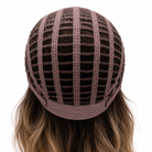 Back view of Phillipa wig showing the brown open-wefted cap construction and long wavy synthetic hair.