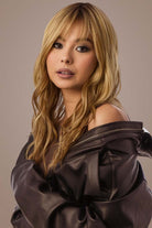 Woman with Bronzed Honey wavy hair & leather jacket