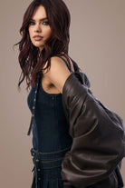Woman with Deep Plum Brown hair and leather jacket