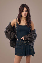Woman in denim dress with Deep Plum Brown hair