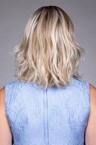 Woman wearing Rebecca wig by Belle Tress in Butterbeer R | Back
