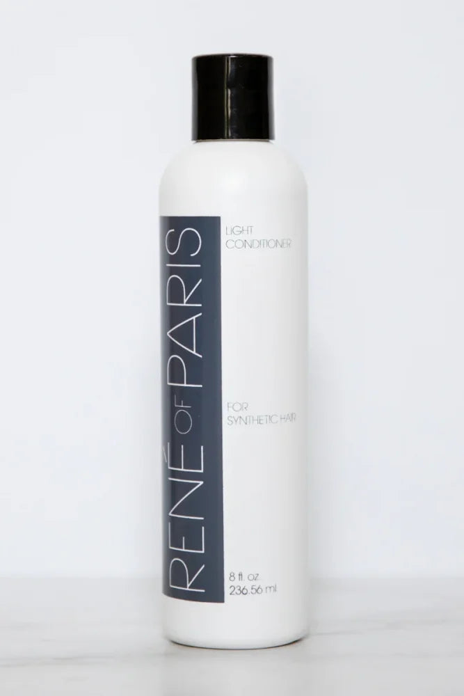 A white bottle of Rene of Paris Light Conditioner for synthetic hair, featuring a black cap and a dark gray vertical label with white text, set against a plain white background.