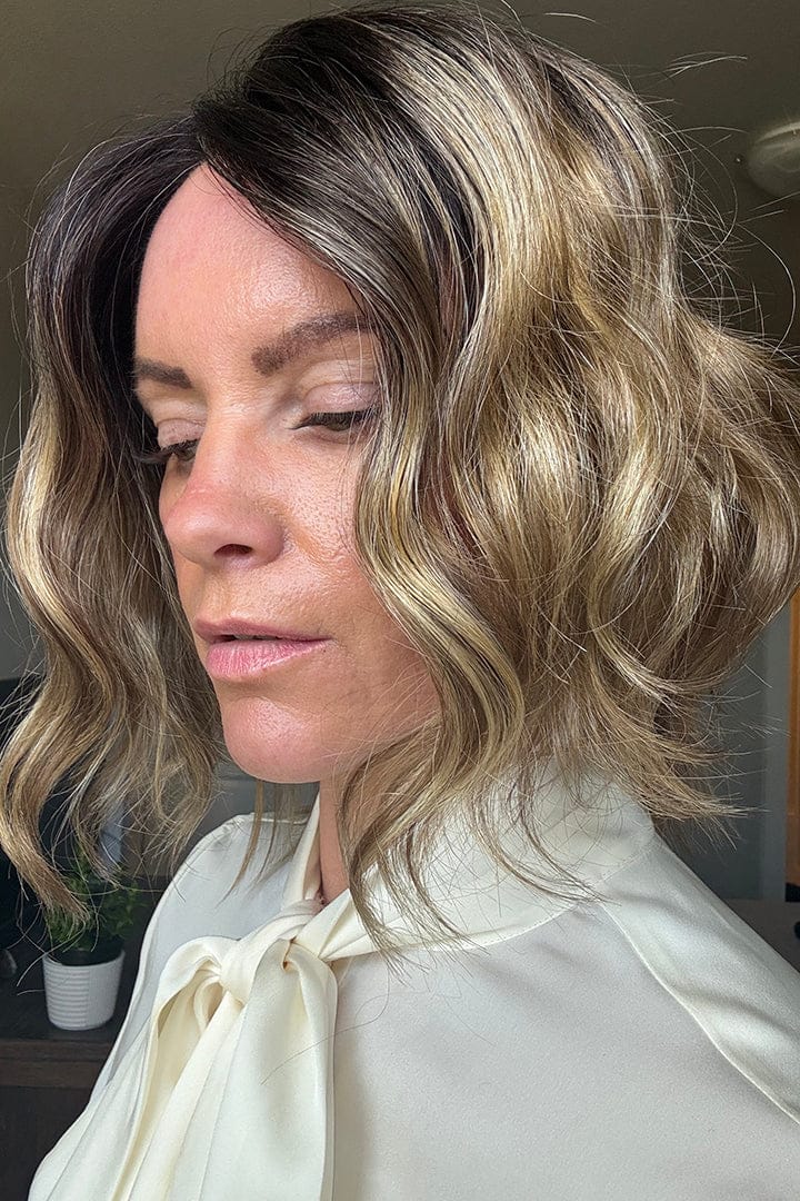 Woman wearing angled bob hair topper (Rene of Paris' Evanna Topper in Mochaccino LR) side
