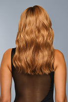 Woman is wearing Decadent Diva wig by Raquel Welch in color RL29/33SS | Back