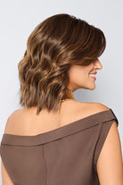 Raquel Welch synthetic lob wig in a warm brown shade with sculpted spiral waves and a natural monofilament top.