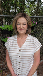Woman wearing timeless brunette bob wig with golden highlights (Tailored Allure by Raquel Welch in SS Iced Cafe Latte)