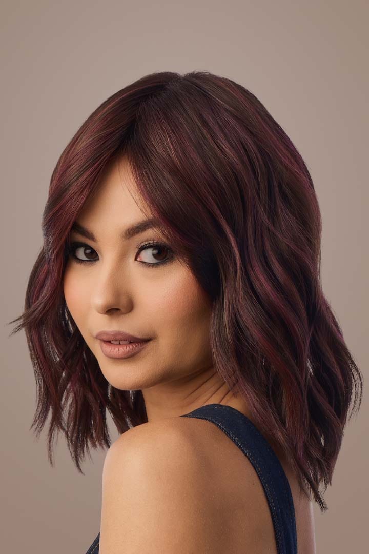 Woman with Smooth Wavez Deep Plum Brown Wig