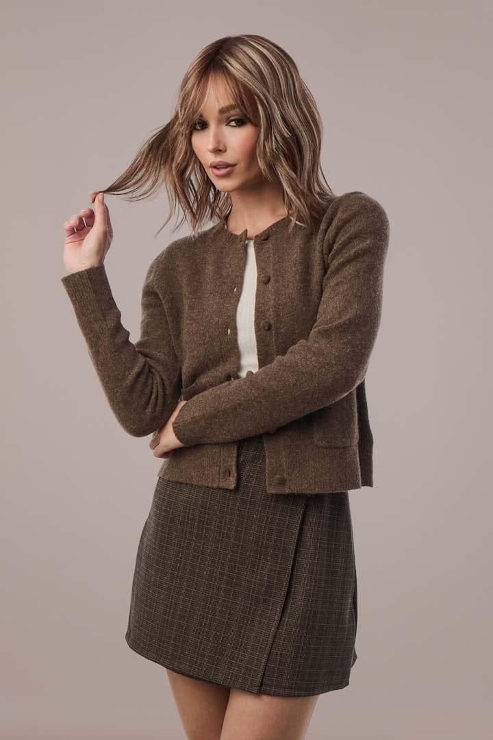 Woman in Snowy Umber cardigan and skirt