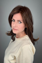 Woman wearing straight layered wig (Stephanie by WigPro in Pine Cone).