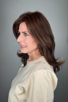 Woman wearing straight layered wig (Stephanie by WigPro in Pine Cone).