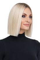 Still Iconic by TressAllure: a sleek, straight blonde bob wig with a center part and natural lace front.