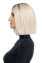 Still Iconic by TressAllure, a sleek blonde blunt-cut bob wig with a dark root and straight, smooth synthetic fibers.