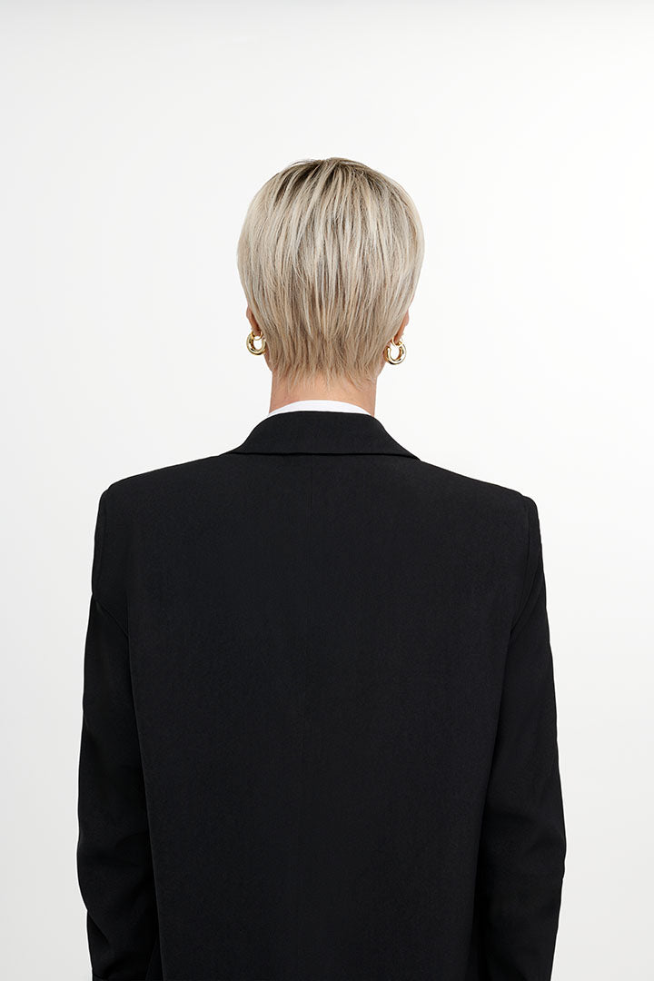 Woman wearing The Free Spirit wig by TressAllure in 613/1001/R18 | Back