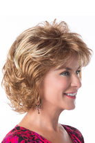 Model is wearing Perfection wig by Toni Brattin in Red Blonde | Right Side