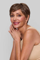 Woman wearing Tess wig by Jon Renau in 8RH14 | Front hands resting on side of face