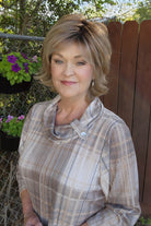 Woman wearing short shag wig (Razor Cut Shag by TressAllure in color Almond Cream).