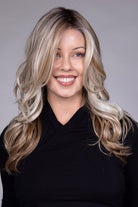 Wisteria by Belle Tress long wavy synthetic wig with blonde money piece highlights and a lace front.