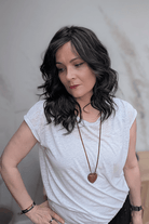Woman wearing curly shouldar length (Belle Tress' Westwood in Coolest Dark Brown R)