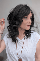 Woman wearing curly shouldar length (Belle Tress' Westwood in Coolest Dark Brown R)