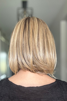 Woman wearing mid-length blonde bob (Bethany by Wig Pro in 12/R8)