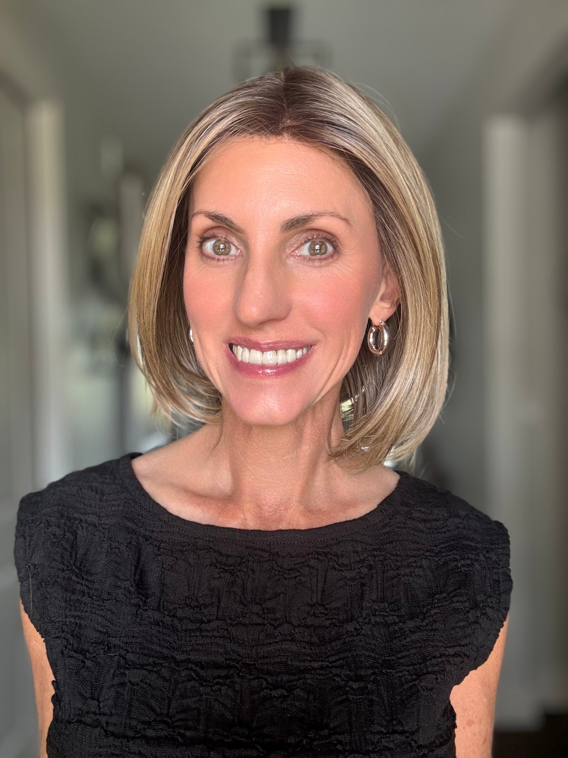 Woman wearing mid-length blonde bob (Bethany by Wig Pro in 12/R8)