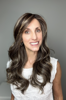 Woman with long, wavy brunette wig with highlights (Witherspoon by Belle Tress in Truffle Cream R)