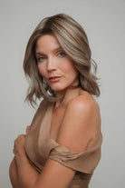 Yui by Noriko medium-length wavy bob wig in a highlighted ash brown shade with a natural lace front.