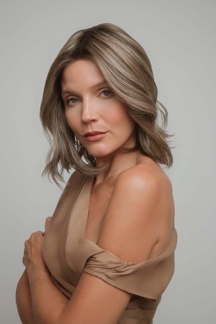 Yui by Noriko medium-length wavy bob wig in a highlighted ash brown shade with a natural lace front.