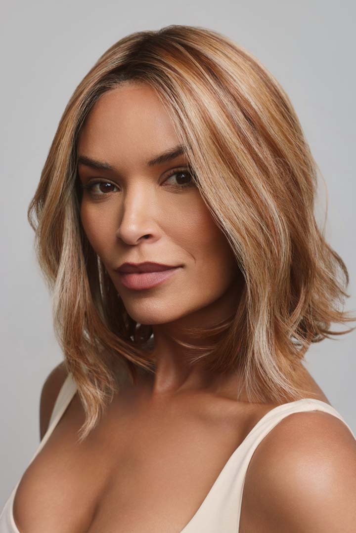 Yui by Noriko medium-length wavy bob wig in highlighted blonde with a natural lace front and monofilament part.