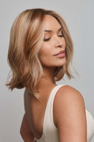 Yui by Noriko medium-length wavy bob wig with a natural lace front and highlighted blonde synthetic hair.