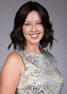 Woman wearing Zurich wig by Belle Tress in Triple Chocolate R | Front smiling