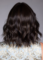 Woman wearing Zurich wig by Belle Tress in Triple Chocolate R | Back