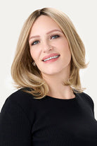 Model is wearing Barely There Straight 12" Topper by Envy in color Prosecco