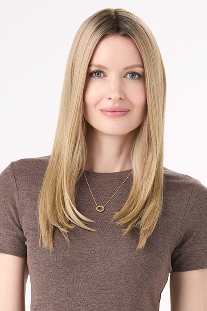 Model is wearing Barely There Straight Hair Topper by Envy 16" in color Blondie