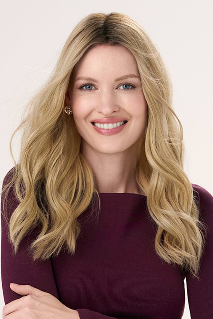 Model is wearing Barely There Wavy Hair Topper 16" by Envy in color Blondie