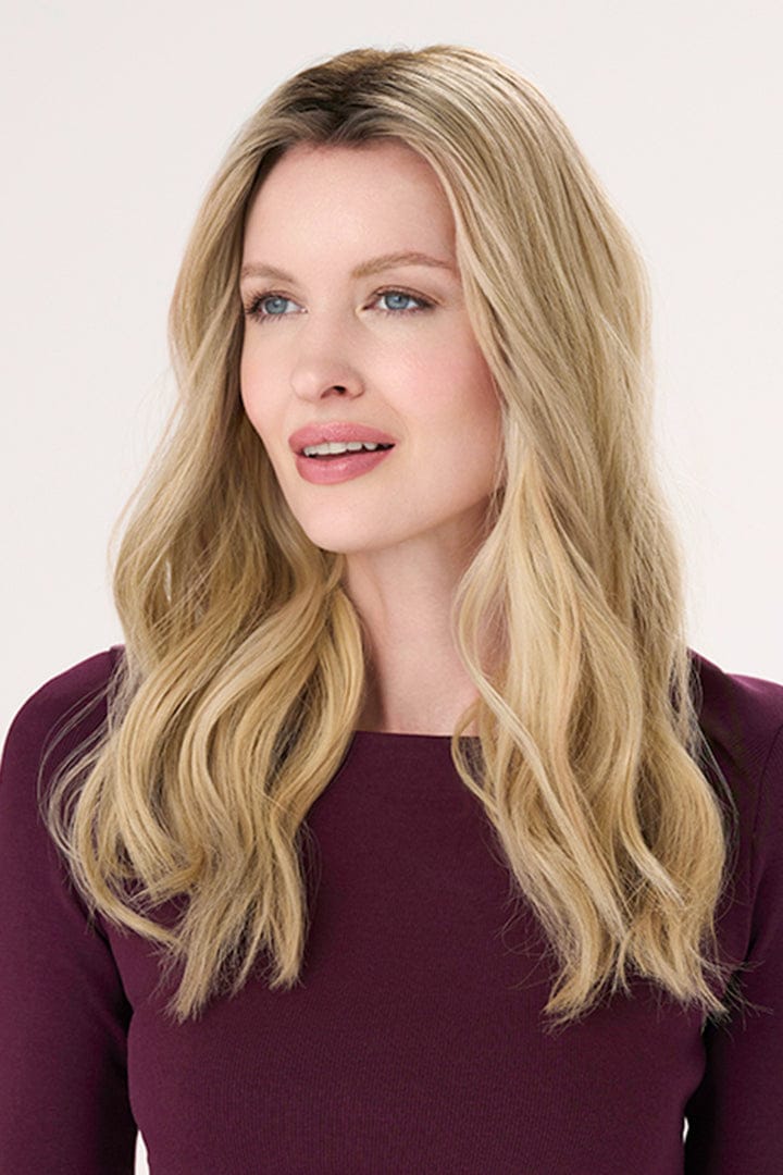 Model is wearing Barely There Wavy Hair Topper 16" by Envy in color Blondie