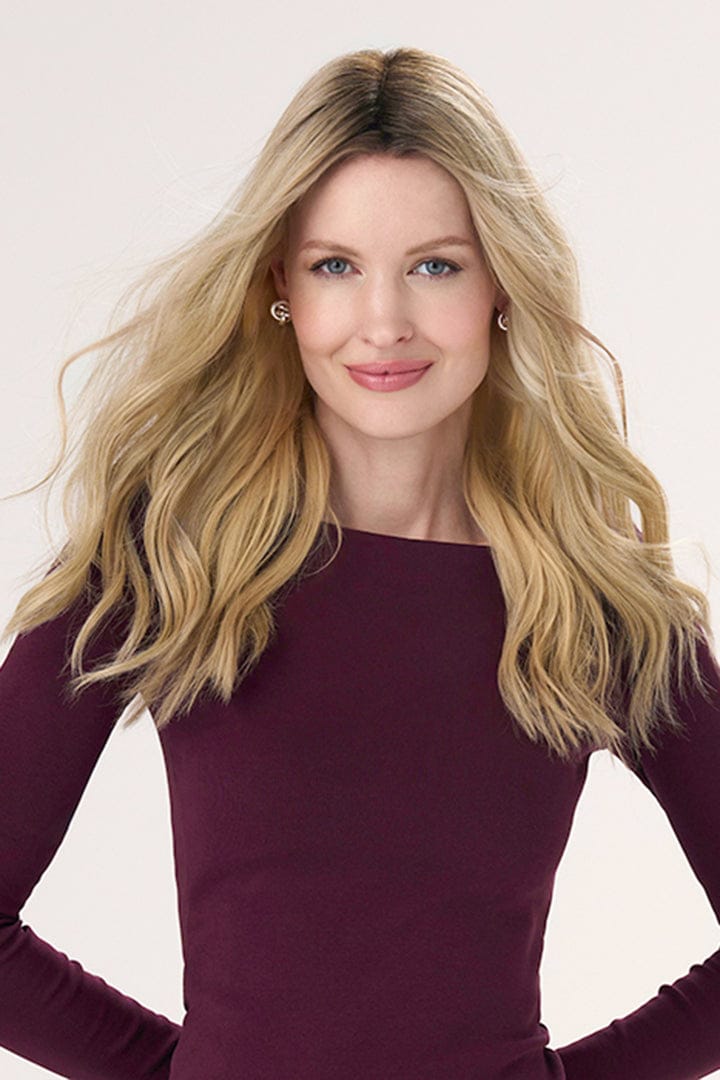 Model is wearing Barely There Wavy Hair Topper 16" by Envy in color Blondie