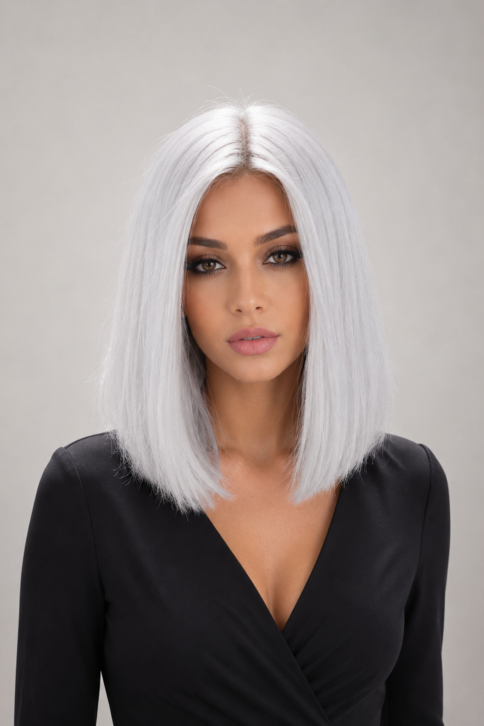 Woman wearing Bespoke 12" Human Hair Wig by PUSH in color Blanche against a plain background - Front view.