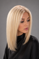 Woman wearing Bespoke Human Hair Wig by PUSH in color Carte Platine | A light, coolish-toned platinum blonde with icy, white hues for a modern, high-impact look. - Front view.