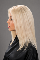 Woman wearing Bespoke Human Hair Wig by PUSH in color Carte Platine | A light, coolish-toned platinum blonde with icy, white hues for a modern, high-impact look. - Side View