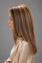 Woman wearing Bespoke Human Hair wig by PUSH - Side View in color Jolie | A base of rich brown, complemented by highlights of light brown and chunky medium natural-ash blonde highlights. 