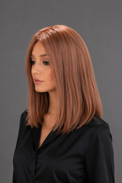 Woman wearing Bespoke Human Hair Wig by PUSH 14" in color Light Ginger Brown Mix with a black blouse on. Left side view.