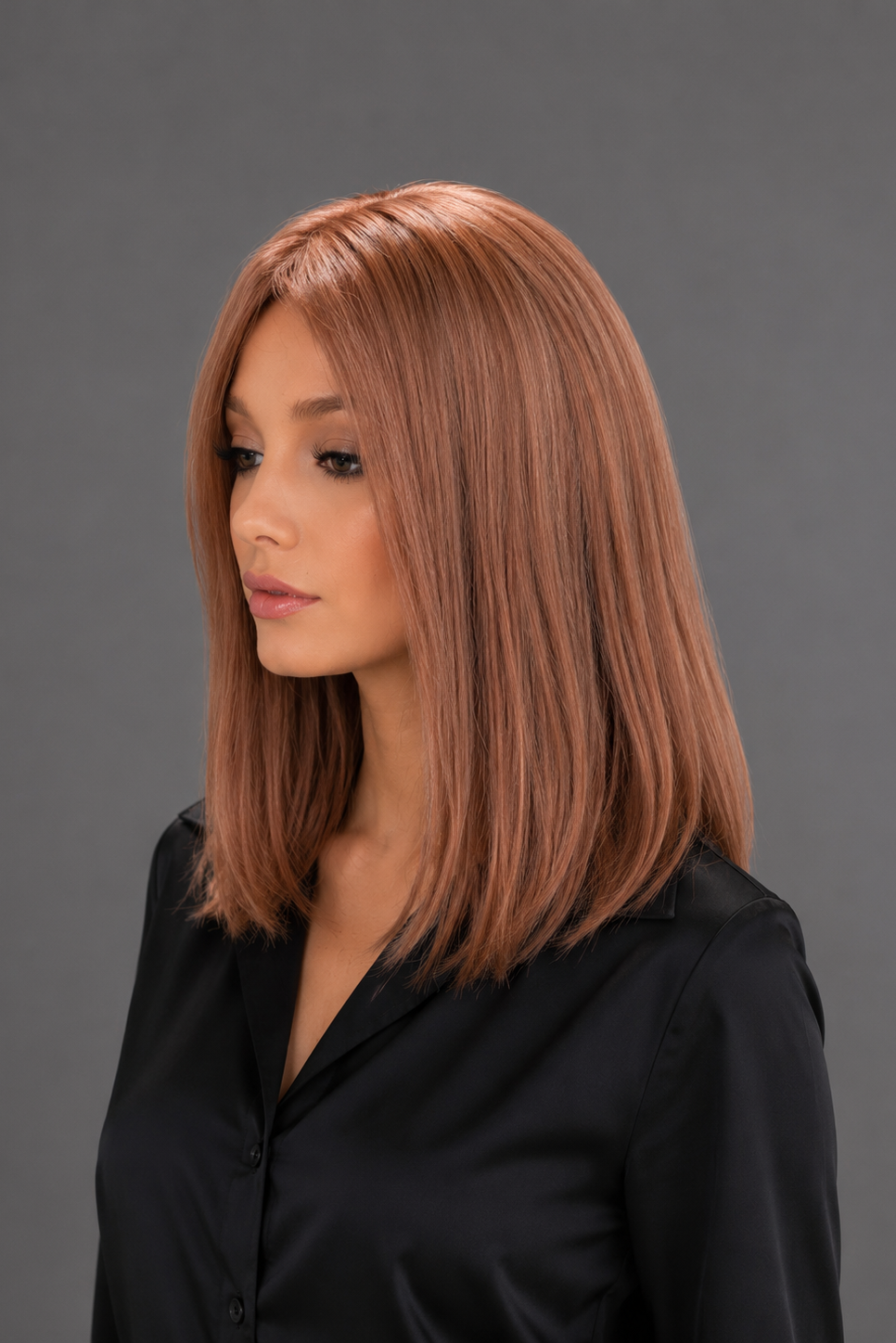 Woman wearing Bespoke Human Hair Wig by PUSH 14" in color Light Ginger Brown Mix with a black blouse on. Left side view.