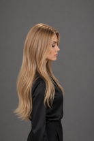 Woman wearing Bespoke Human Hair Wig by PUSH 20-26" in color Brûlée Dorée with black blouse and pants. Right side view.